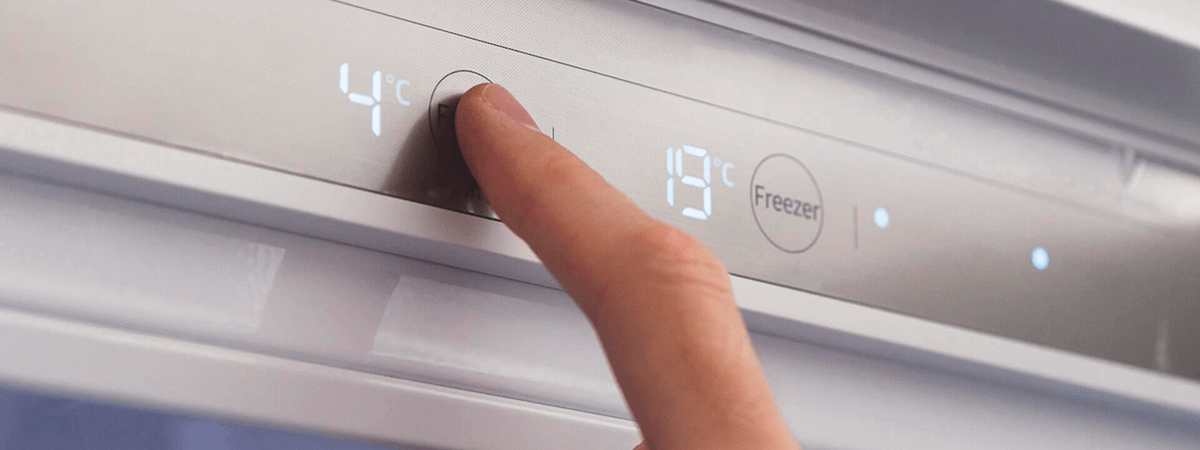 Checking the temperature of a fridge