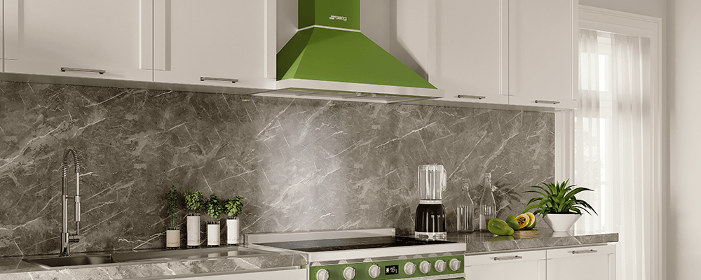 Olive green Smeg chimney hood shown in modern kitchen with matching green cooker.