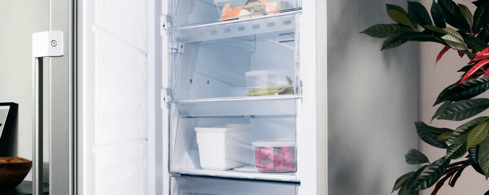 Opened Hotpoint frost free freezer with food samples inside.