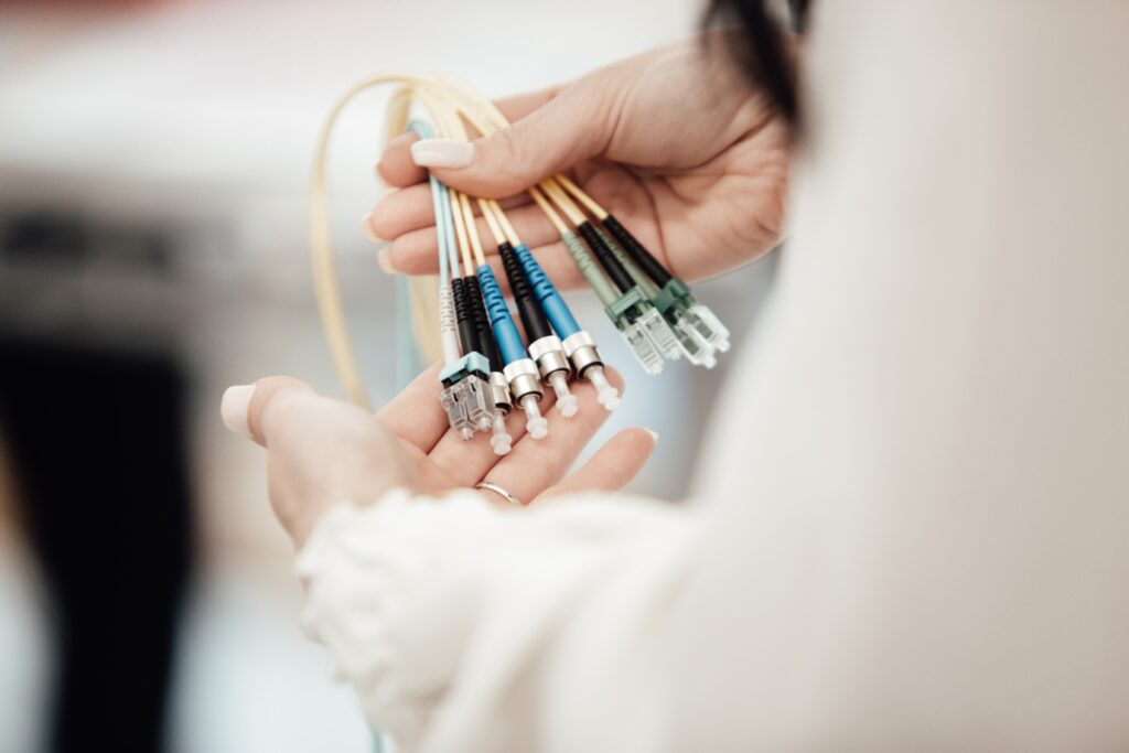 Woman holding different wires