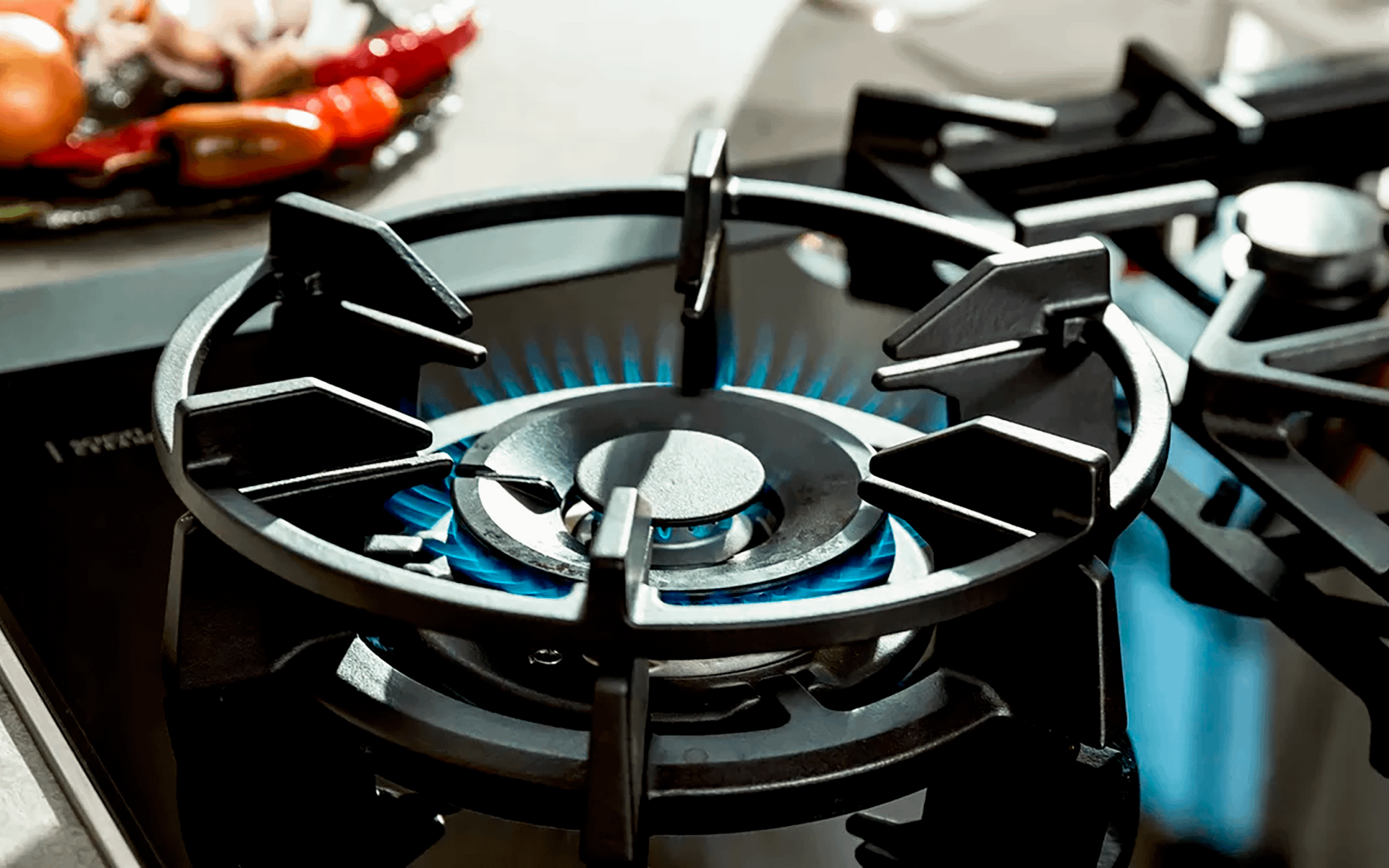 Close up of a Neff gas hob on a low setting