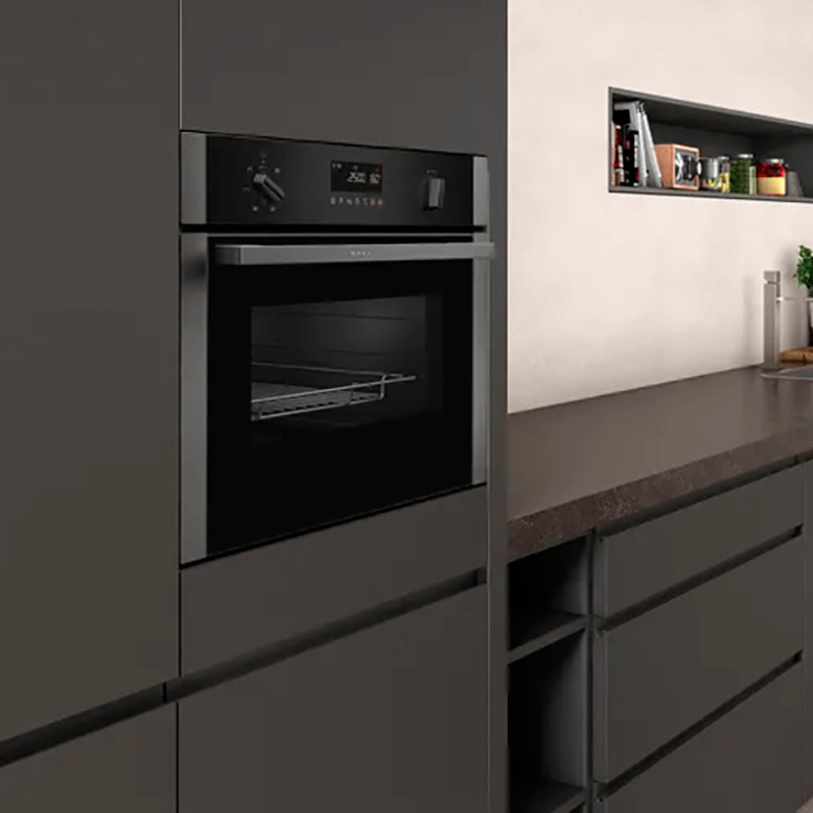 Neff compact oven with microwave built into a graphite coloured cabinet.