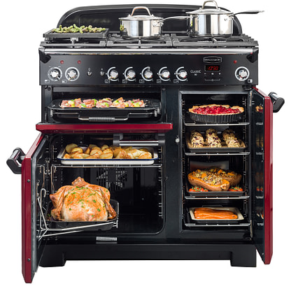 Rangemaster range cooker in red, opened up and showing different cavities