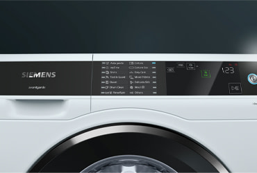 Top of a Siemens drawer, displaying the control panel and different washing machine functions