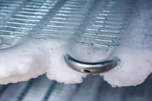 Freezer packed with ice, ready for defrosting