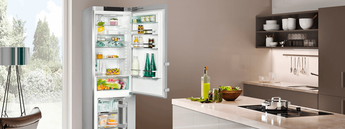 Liebherr fridge with door open in a modern looking kitchen