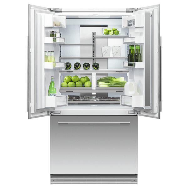 Fisher & Paykel American style fridge freezer featuring the fridge above freezer. The fridge doors are open showing fresh produce inside including apples, water, beer and leeks. 