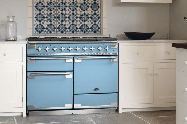 A china blue Rangemaster range cooker  set in a cream kitchen