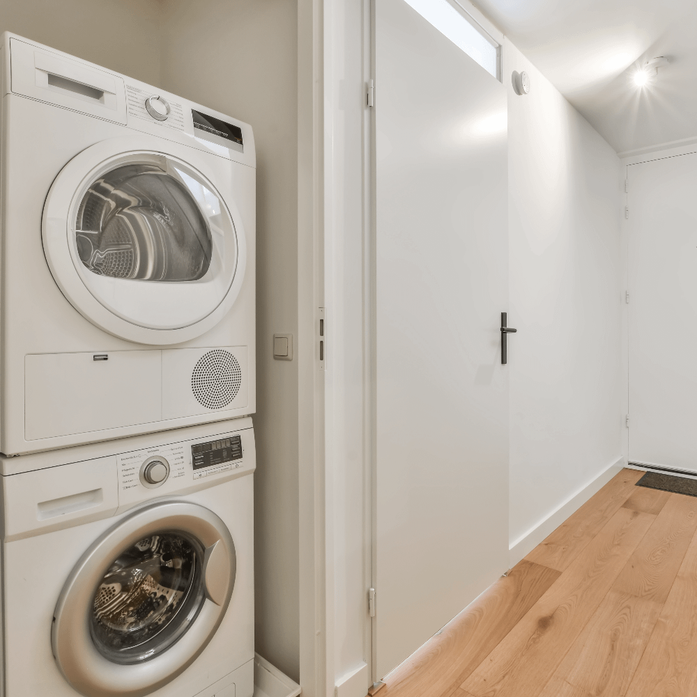 Washing machine and dryer in hallway cupboard