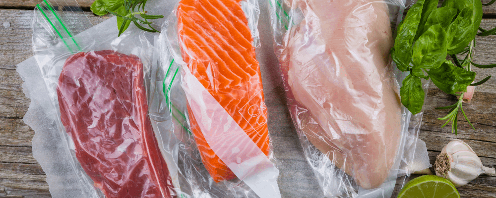 Meat and fish in vacuum sealed bags ready for sous vide cooking