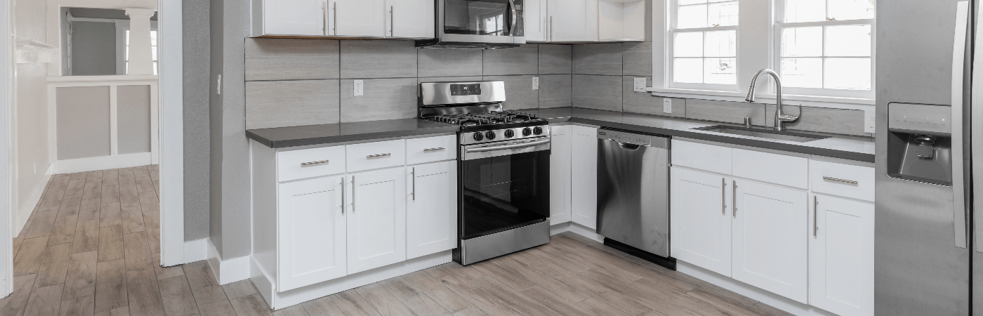 White and grey l-shaped kitchen layout
