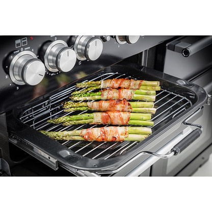 Open rangemaster range cooker grill with asparagus in