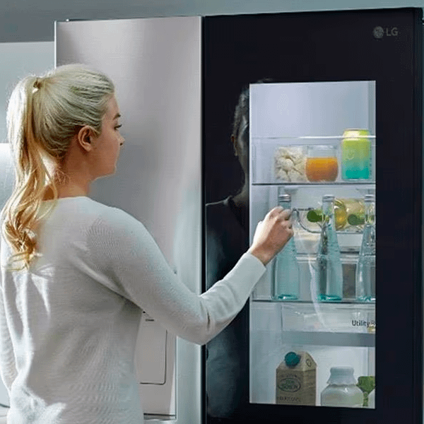 Woman knocking on LG Instaview fridge