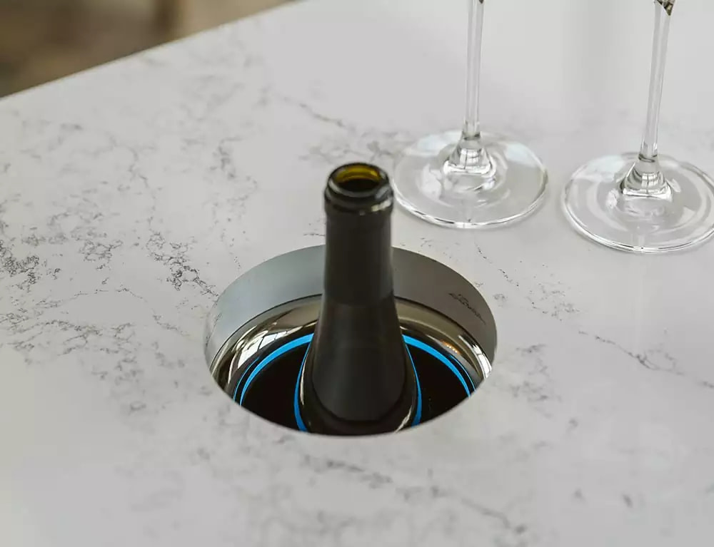 A bottle of wine sat in a Kaelo with an undermount design.
