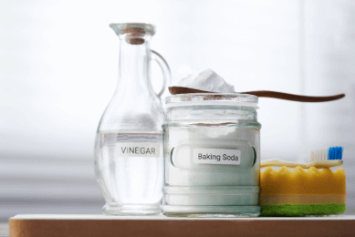 Baking sofa and white vinegar in labelled glass containers