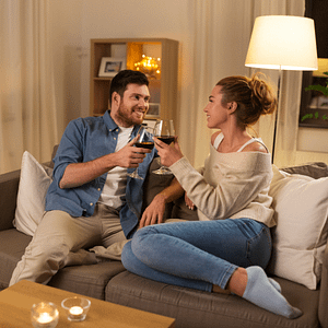 Couple drinking wine on sofa