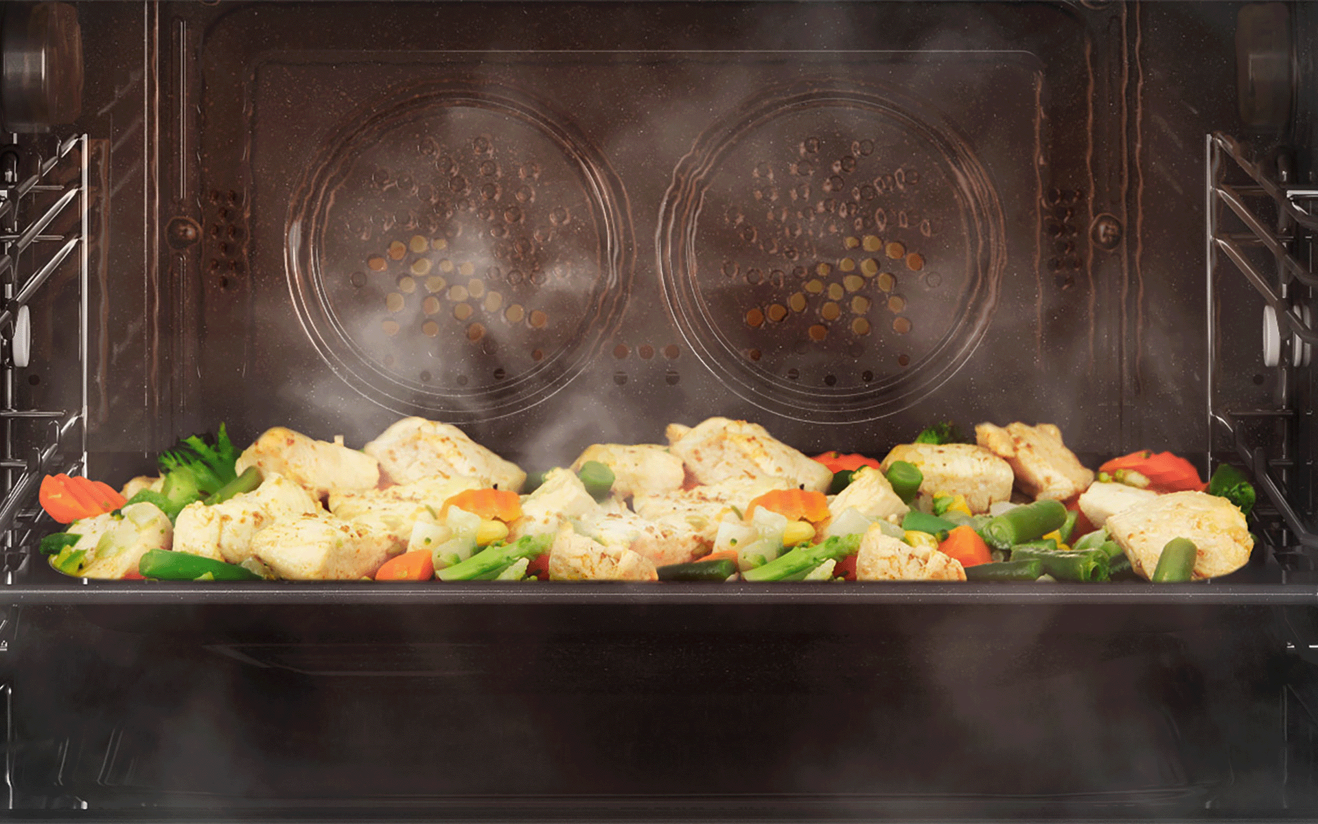 Close-up of vegetables cooking inside of a steam oven