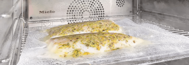 Fish cooking in a vacuum sealed bag in a Miele steam oven. Sous vide cooking.
