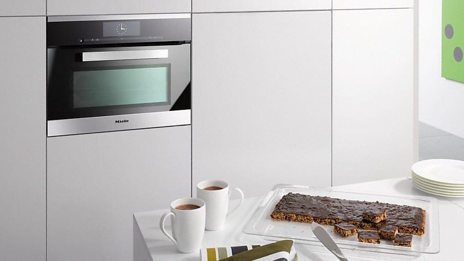 Miele microwave combi with freshly baked goods on the kitchen counter