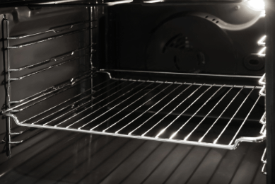 A clean oven with one rack