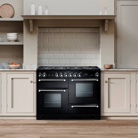 Rangemaster black Kitchener 110cm range cooker in a beige kitchen