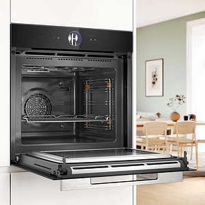 Opened and empty Bosch multifunction oven with microwave.
