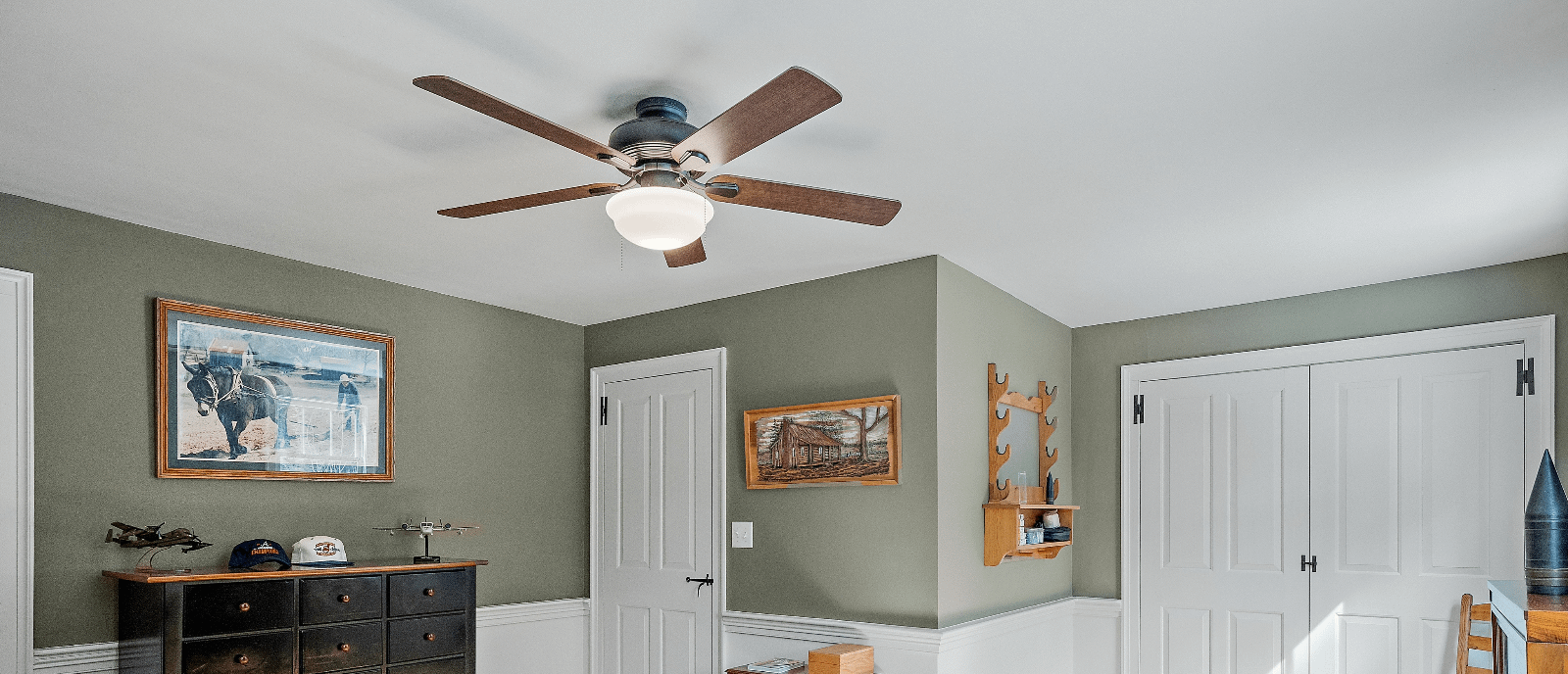 Ceiling fan on white ceiling in green room