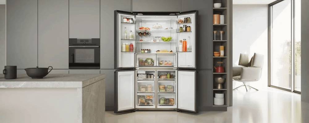 Haier fridge shown with all 4 doors wide open. Built into cabinet.