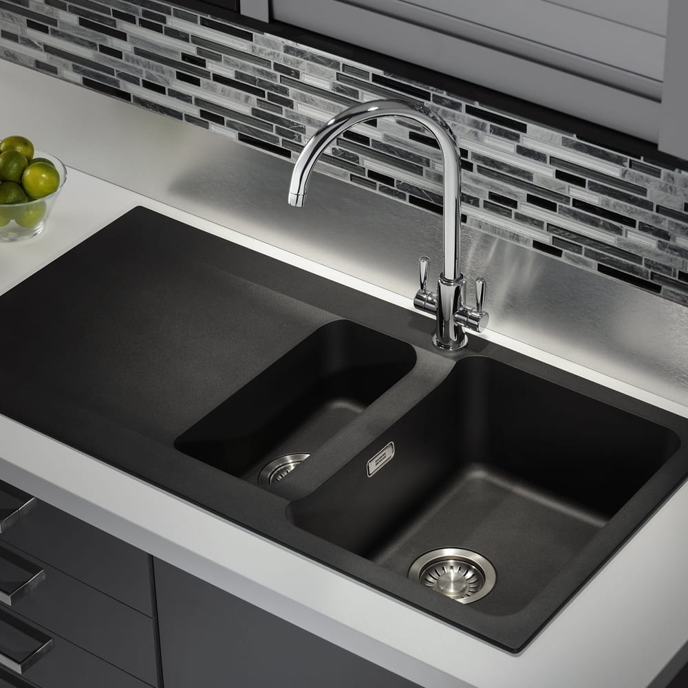 franke-OID651-1-1000x1000 Image of a Franke Orion tectonite sink finished in black. Positioned in a black and white kitchen with a patterned tile splashback.