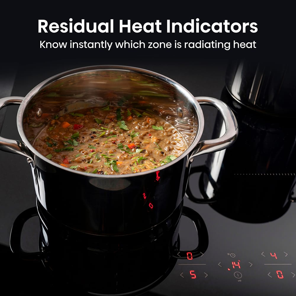 Large saucepan cooking stew showcasing the Hisense hob residual heat indicators.