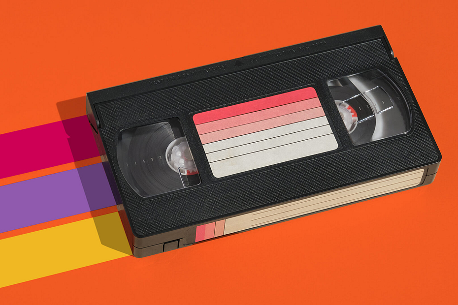 A VHS tape on an orange background