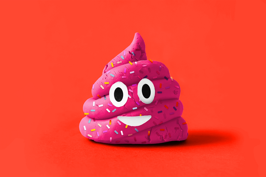 A pink poop emoji covered in sprinkles
