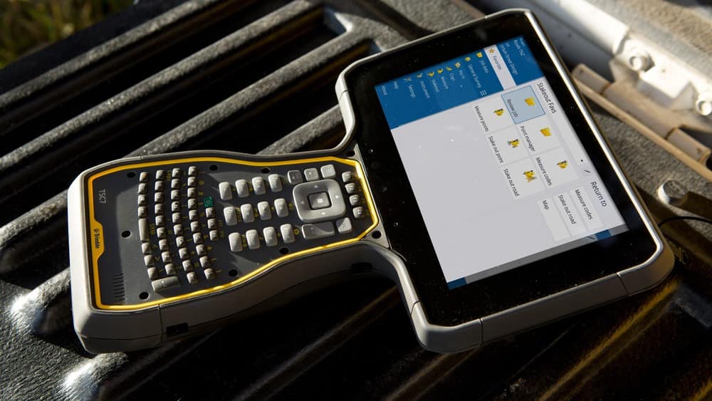 Trimble TSC7 data collector with screen showing survey data files
