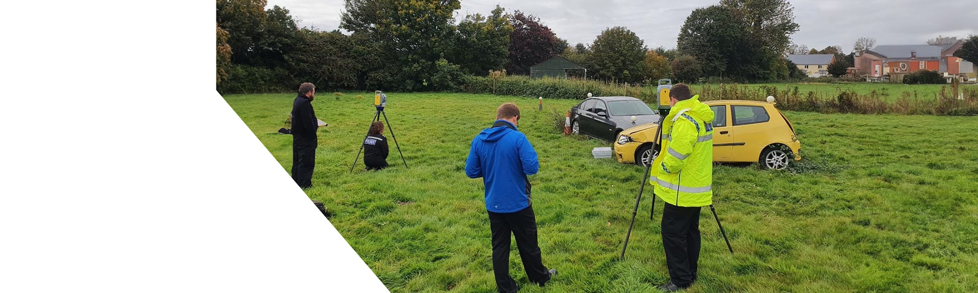 Police and surveyors using Trimble laser scanners at the scene of a 2-vehicle car accident