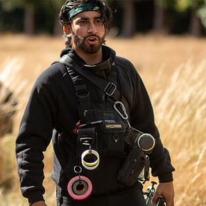 Riaz wearing our LED Chest Rig on a film set with gaffer tape attachments