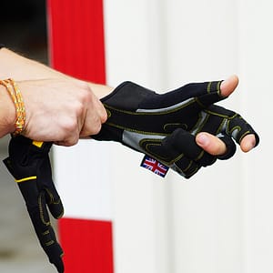 Rigger putting on a Dirty Rigger work glove to show the glove fit