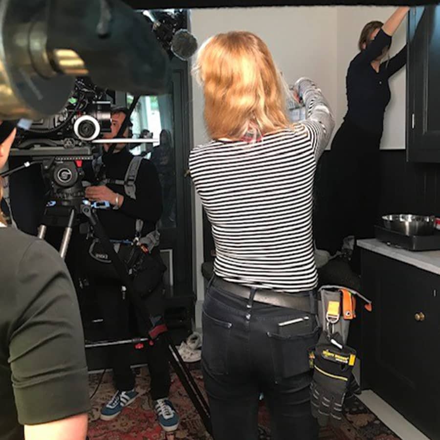 Camera assistant Bianka on set with a gaffer tape attachment and Dirty Rigger comfort fit gloves