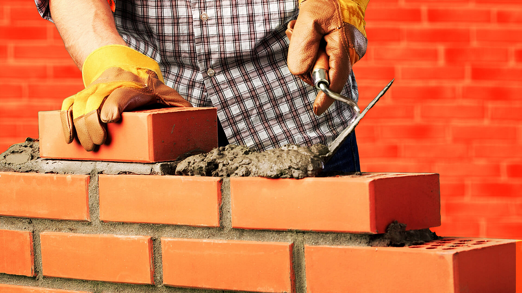 A bricklayer laying bricks