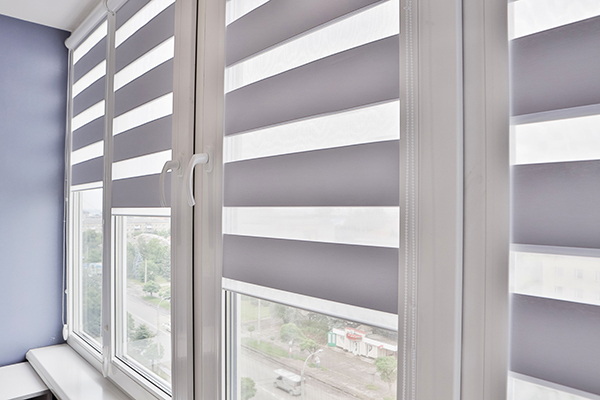Closeup of window with striped blinds