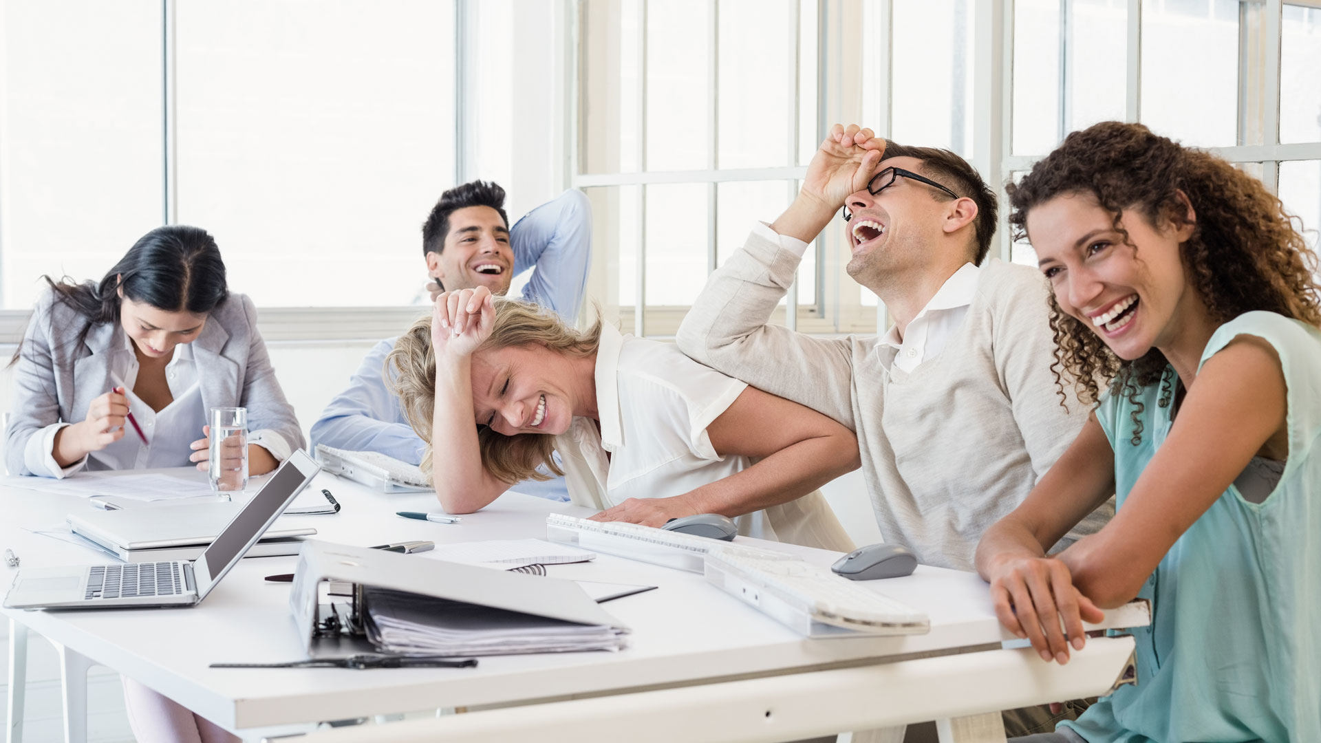 People laughing in a meeting