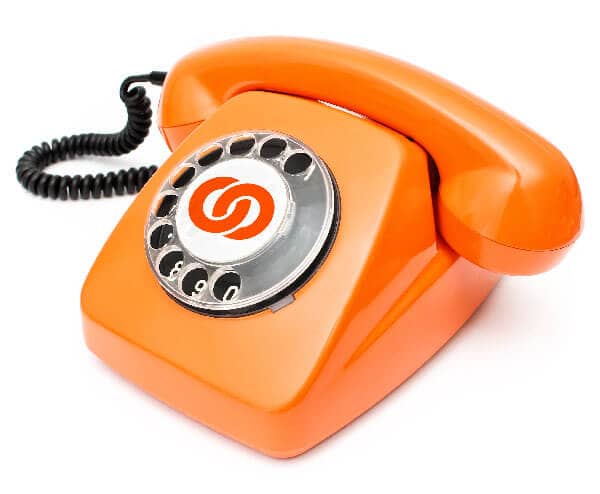 An old-fashioned orange telephone